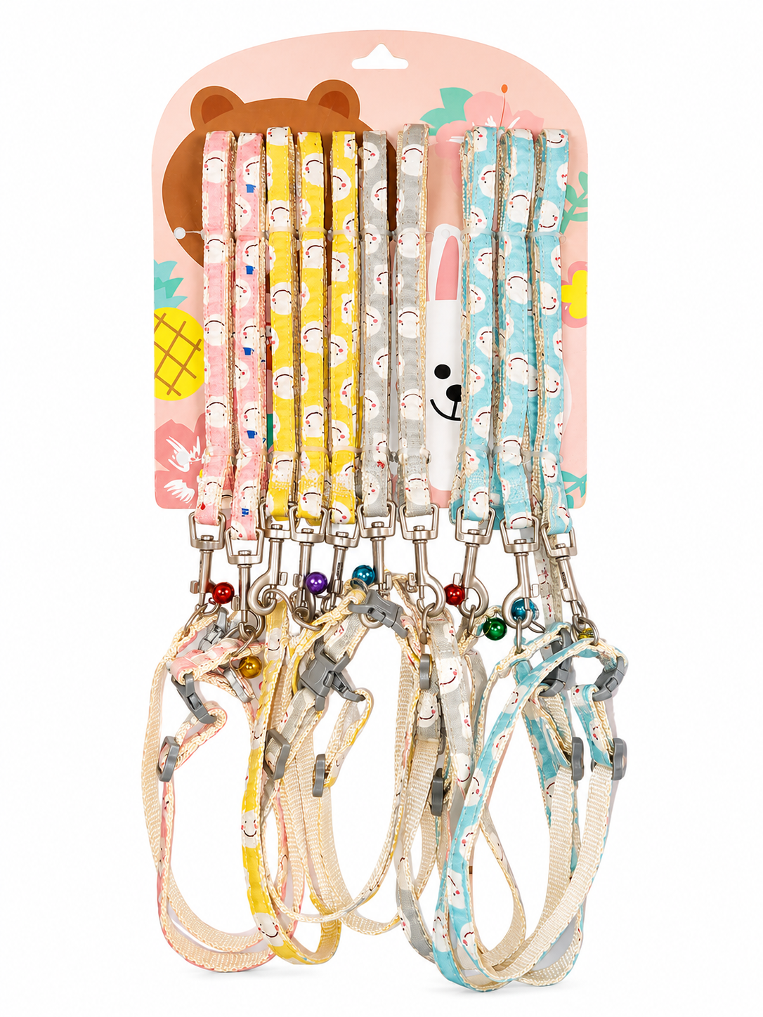 Six colorful dog leashes with matching collars hanging from a pink cardboard display card featuring cartoon bear and bunny illustrations. pet shop lebanon , chouchou shop
